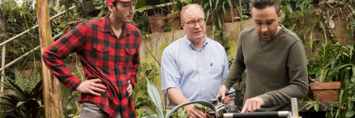  Graduate student Philip Bentz, professor James Leebens-Mack, and graduate student Rick Field use a carbon dioxide sensor on a plant in the horticulture greenhouses.